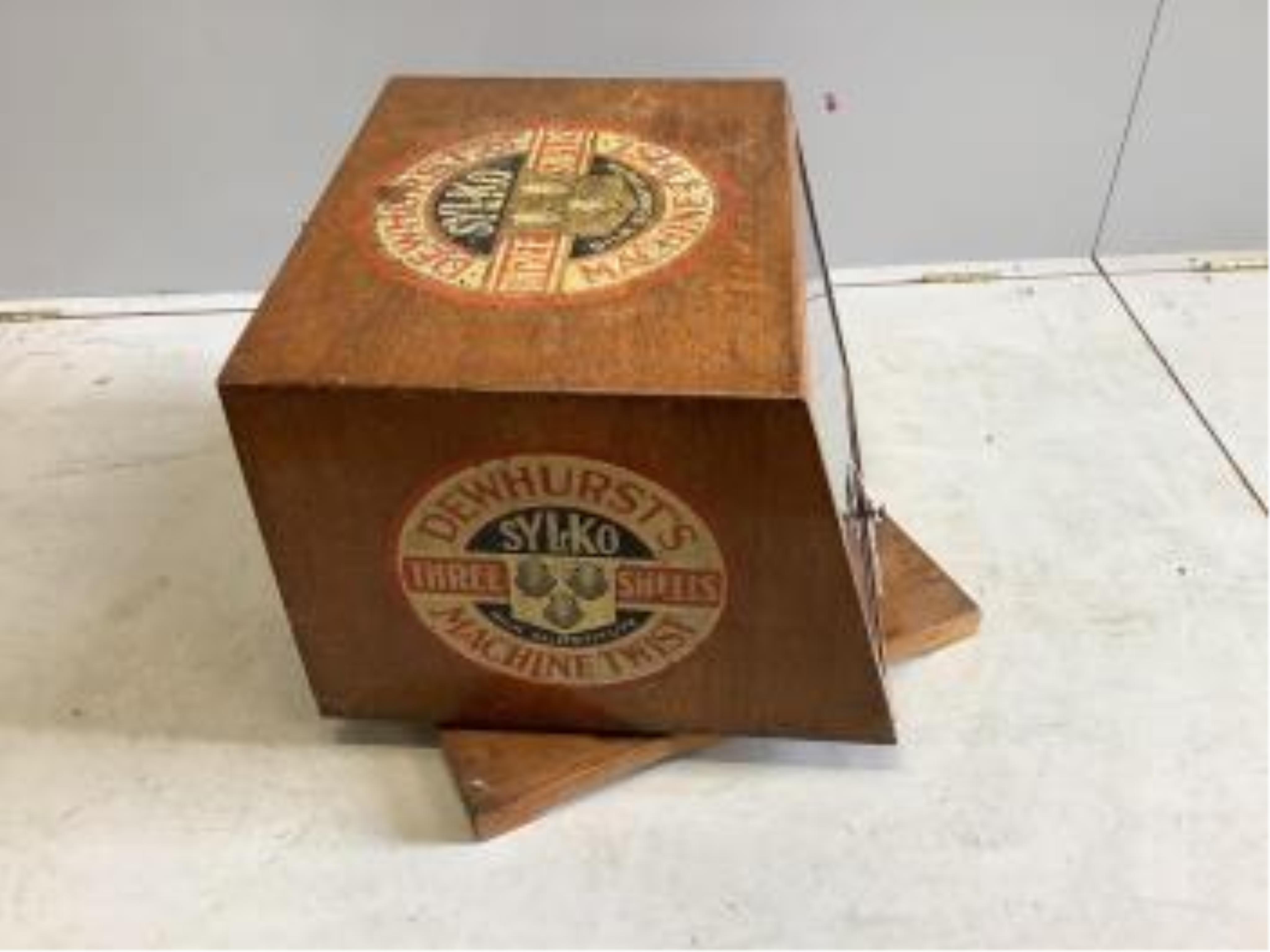 An early 20th century oak counter top display case, 'Dewhursts Sylko three shells machine twist' on revolving base, width 54cm, depth 53cm, height 43cm. Condition - fair